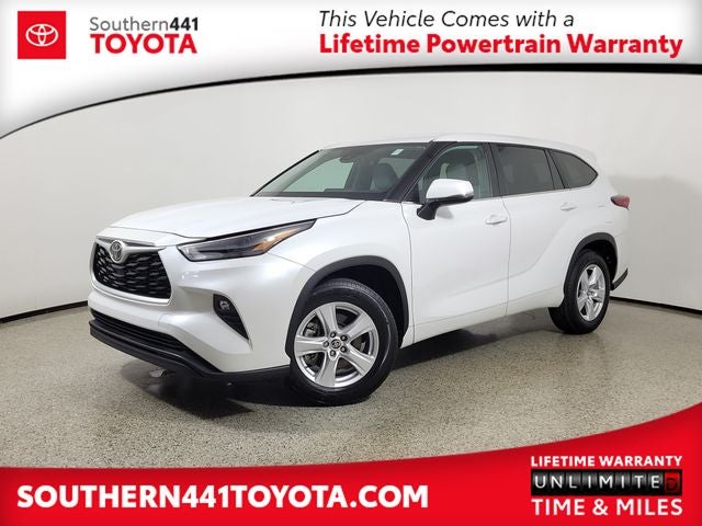 2023 Toyota Highlander LE in Wind Chill Pearl — front three-quarter view