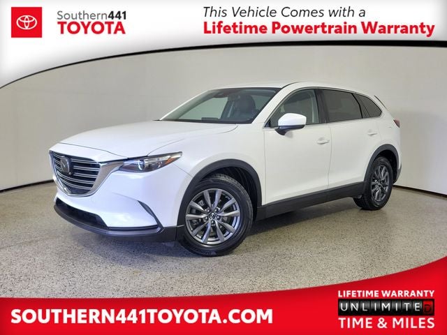 2021 Mazda Mazda CX-9 Touring in Snowflake White Pearl — front three-quarter view