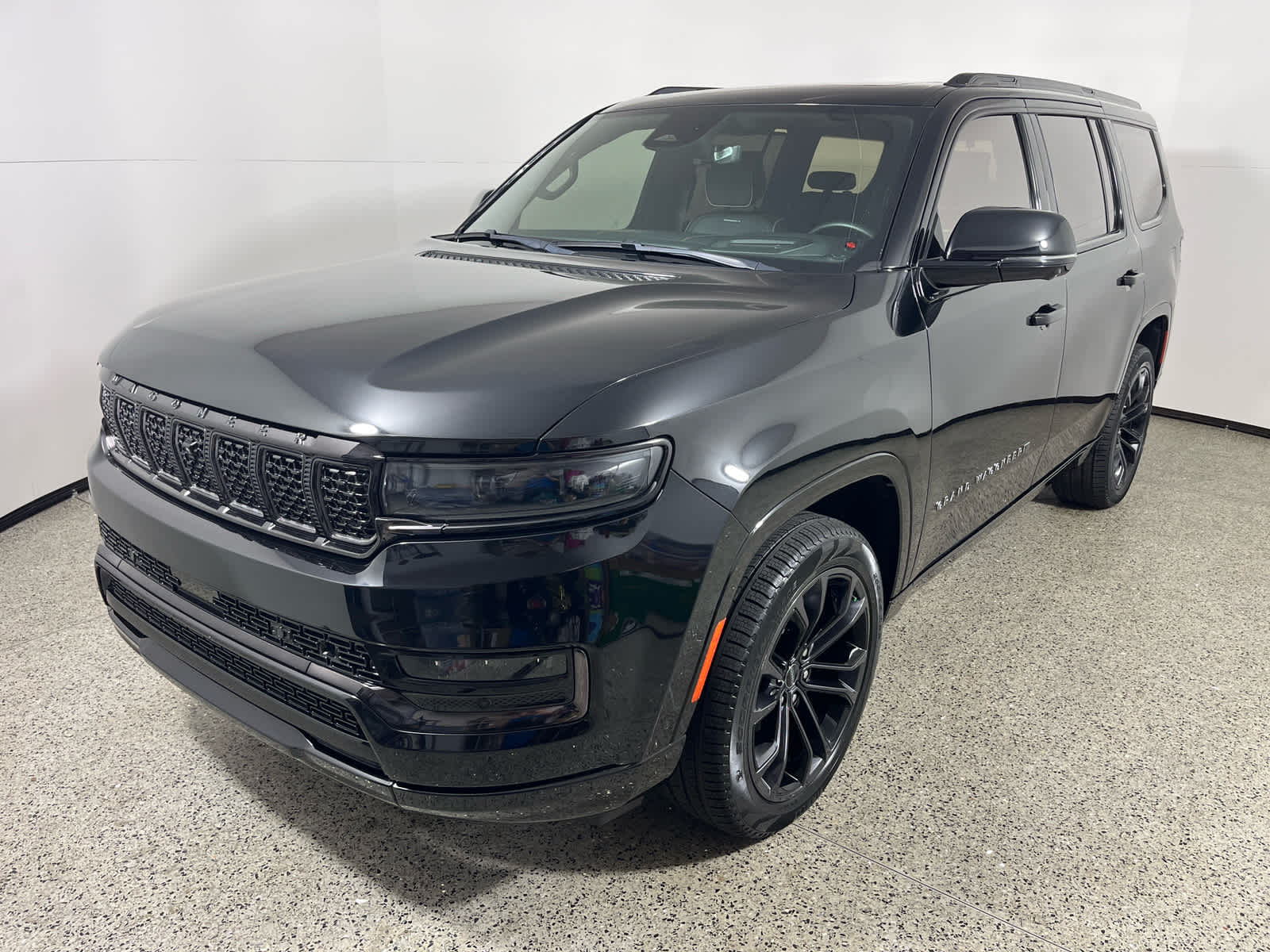2024 Jeep Grand Wagoneer Series III Obsidian in Diamond Black Crystal Pearlcoat — front three-quarter view
