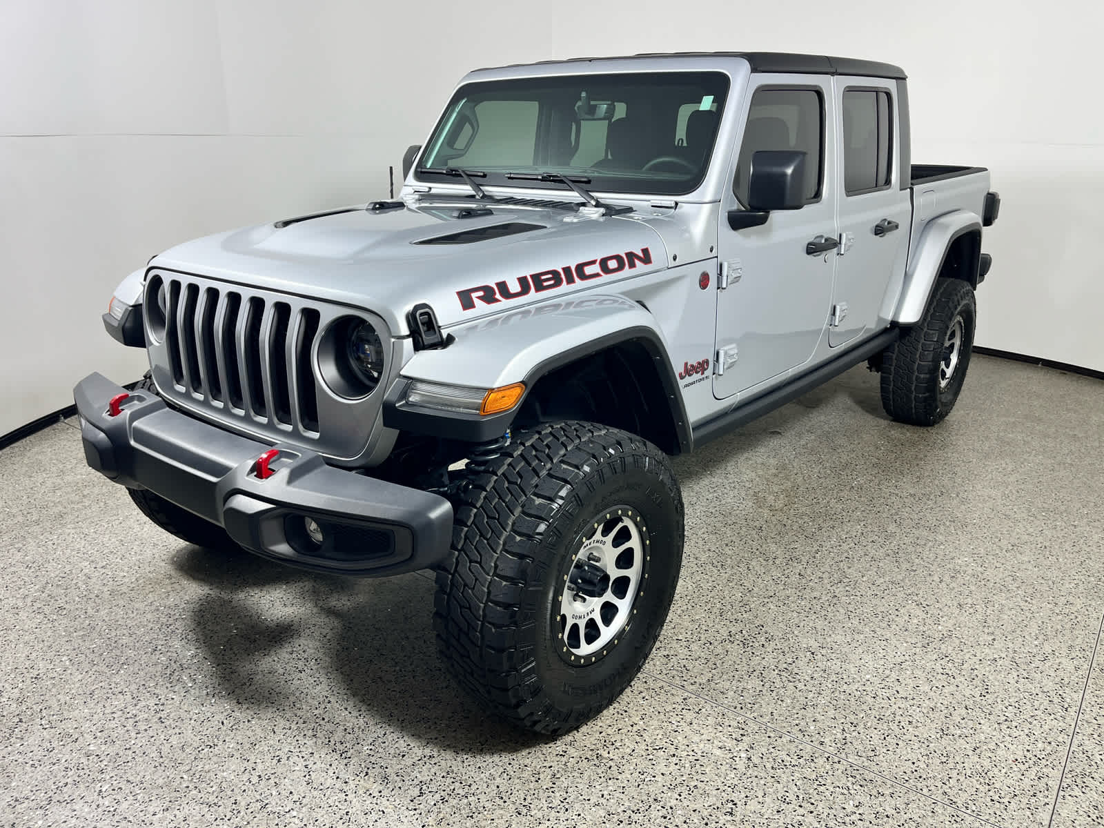 2023 Jeep Gladiator Rubicon in Silver Zynith Clearcoat — front three-quarter view