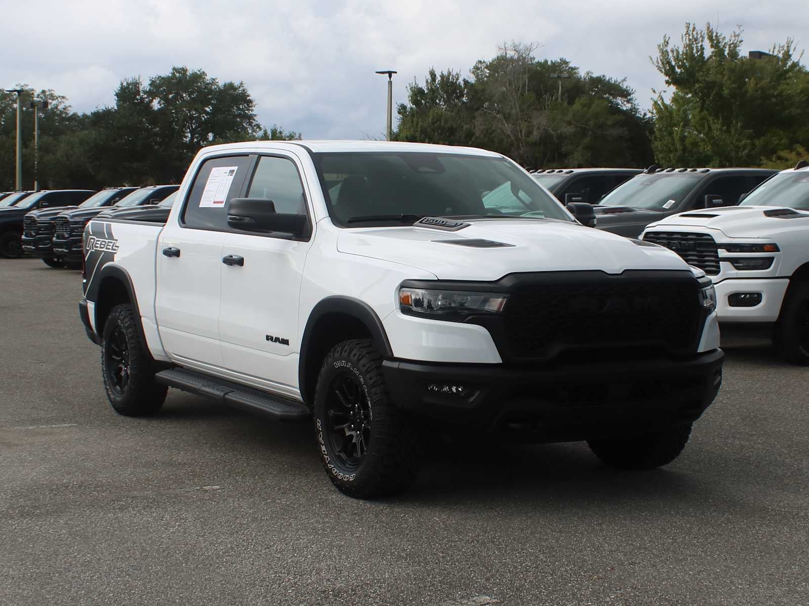 2025 RAM 1500 Rebel in Bright White Clearcoat — front three-quarter view