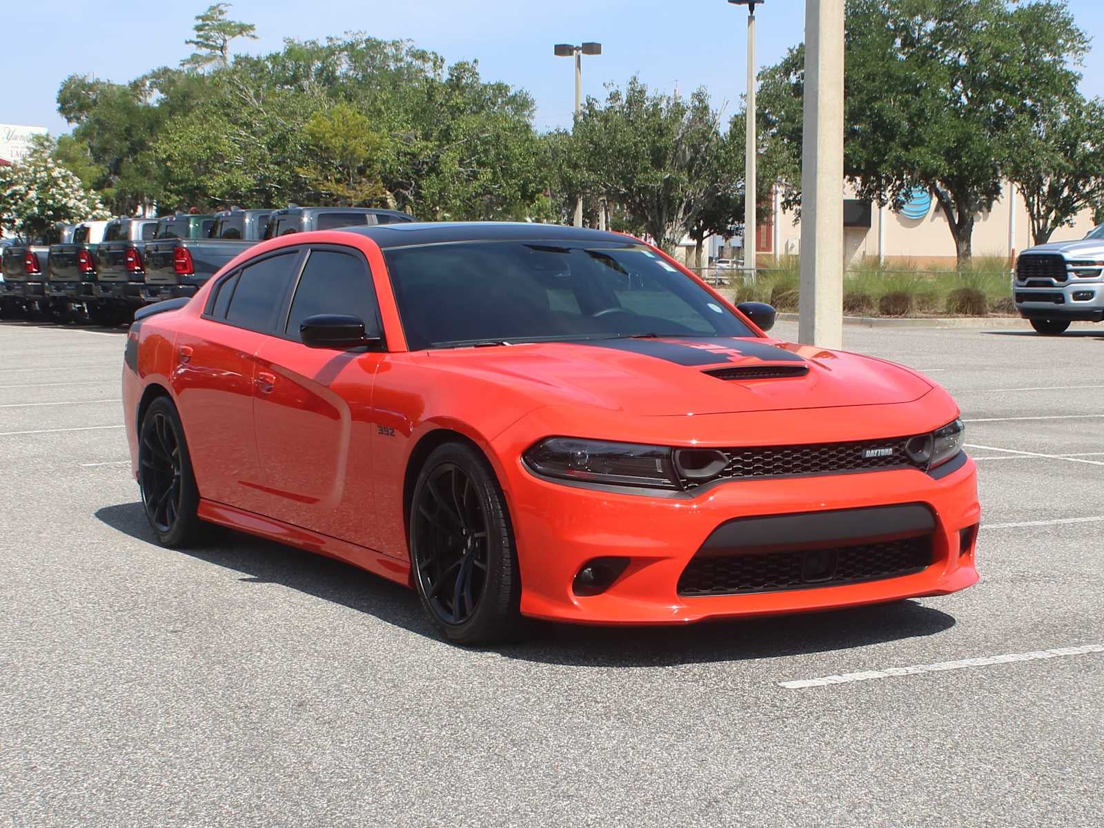 2023 Dodge Charger Scat Pack in Go Mango — front three-quarter view