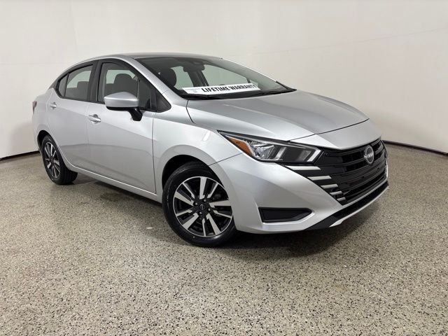 2024 Nissan Versa 1.6 SV in Brilliant Silver Metallic — front three-quarter view