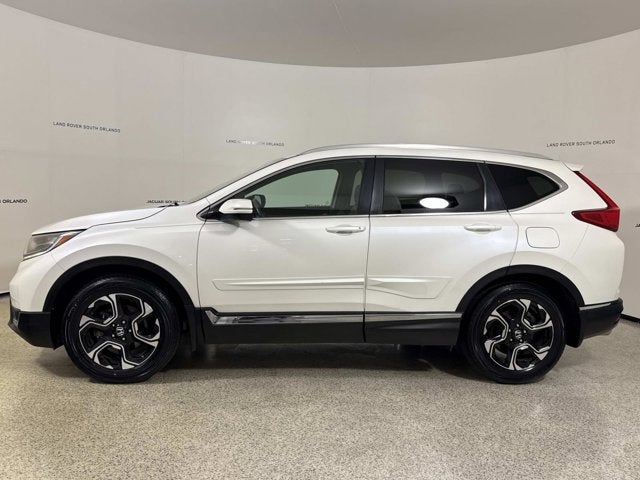 2017 Honda CR-V Touring in Obsidian Blue Pearl — front three-quarter view