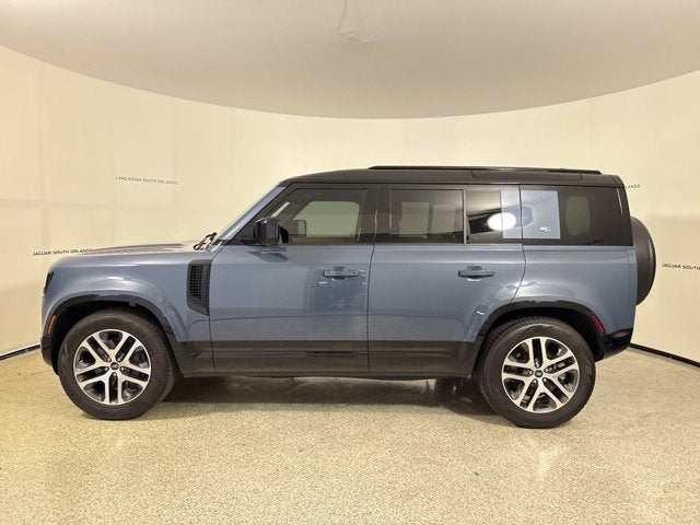 2023 Land Rover Defender X-Dynamic SE in Tasman Blue Metallic — front three-quarter view