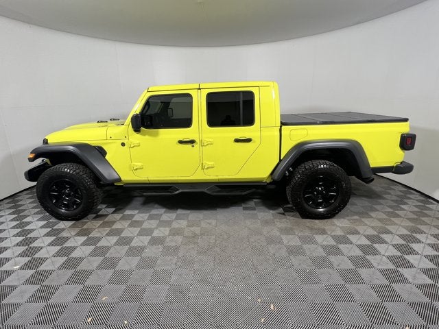 2023 Jeep Gladiator Mojave 4x4 in High Velocity Clearcoat — front three-quarter view