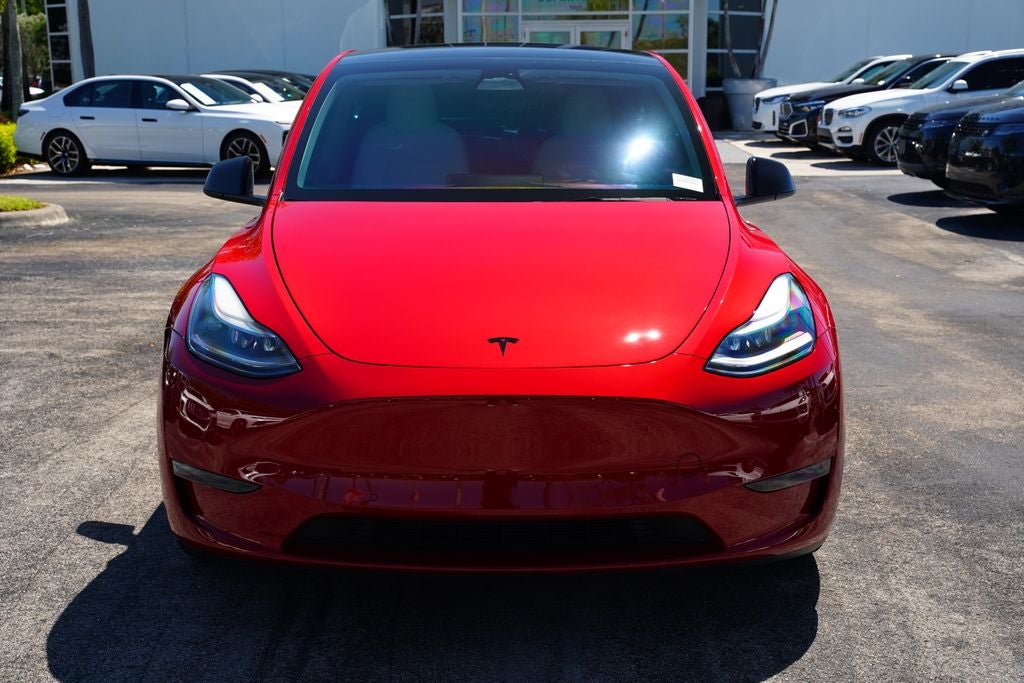 2022 Tesla Model Y Performance in Red Multi-Coat — front three-quarter view