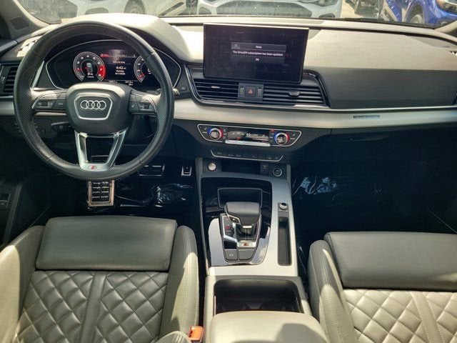 2021 Audi SQ5 Premium Plus in Glacier White Metallic — front three-quarter view