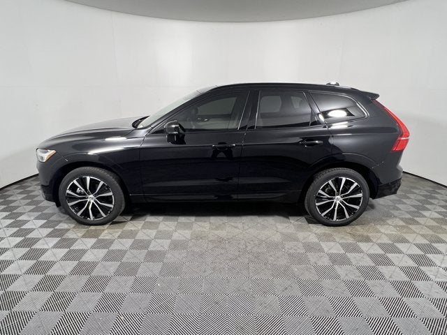 2025 Volvo XC60 Plus in Onyx Black Metallic — front three-quarter view
